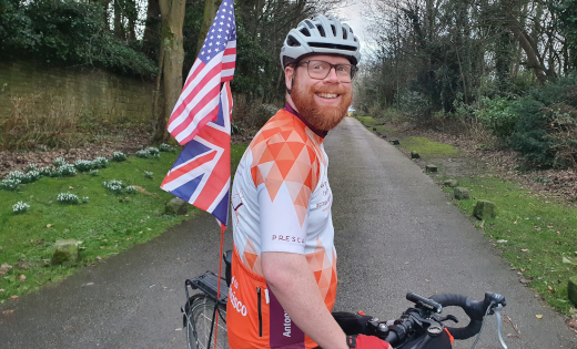 Antony Butcher, from SES, poses on the bicycle he will use to cycle across America for charity.