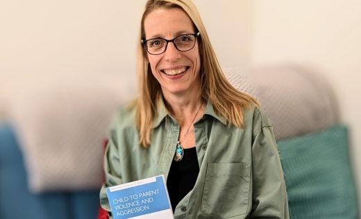 Hedwig Verhagen with her book ‘Parenting a child affected by child to parent violence and aggression’