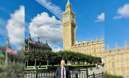 Sascha Stollhans standing outside the Palace of Westminster with Big Ben in the background
