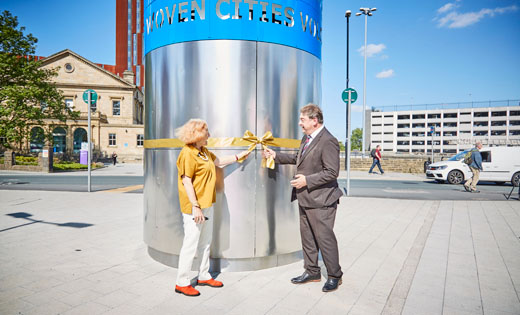 Artist Liliane Lijn and Dennis Hopper, Director of Campus Development, perform the official unveiling of the new sculpture