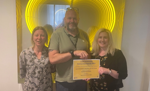 Dawn Abel, John Dodds and Harriet Boatwright with their certificate for the cross-institution partnership award