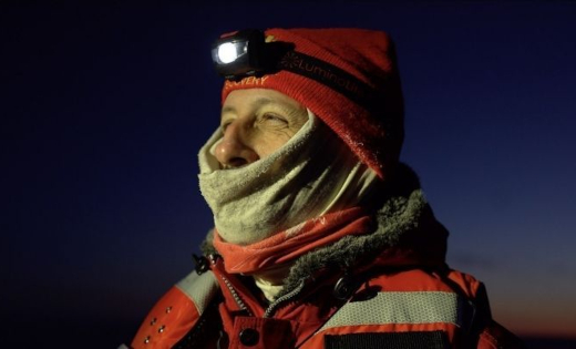 Professor Ian Brooks in a dark polar landscape.