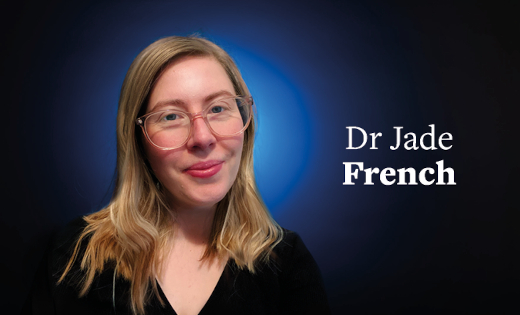 Dr Jade French in front of a black background with a blue colour splash.