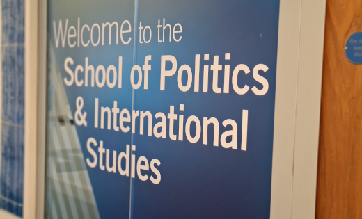 The welcome sign at the entrance to the School of Politics and International Studies.
