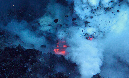 Volcanic eruption deep in the ocean. 