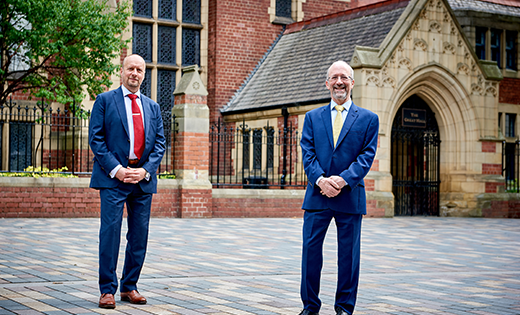 Professors David Sebag-Montefiore and John Ladbury stood in front of the Great Hall
