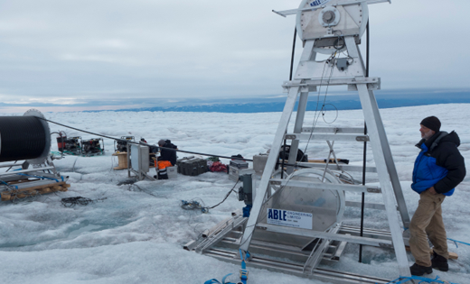 Researchers in Greenland installing fibre-optic cables