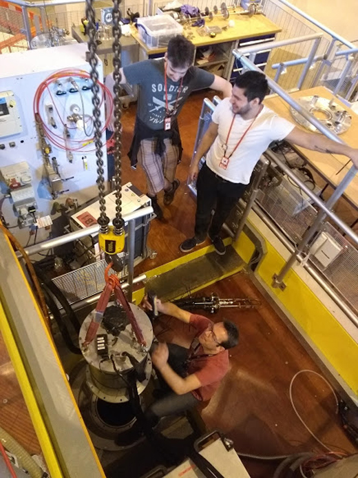 Harry Laurent and Ben Hanson doing an experiment on the NIMROD instrument at the ISIS neutron facility, with instrument scientist Tristan Youngs June 2018