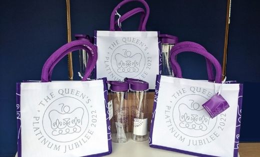 Shows bags and water bottles with Jubilee logo on.