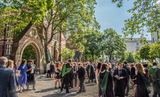 Image of graduating students outside the Great Hall building at the University of Leeds