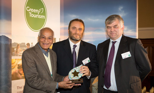 Mike Leonard and Chris Storey accepting the Green Tourism Award from Santish Kumar