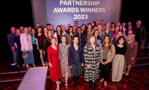 The winners of the Leeds Partnership Awards 2023 all standing together on the stage at Leeds University Union