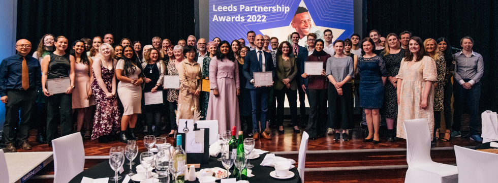 The winners of the 2022 Leeds Partnership Awards gathered on stage at the end of the award presentation event.