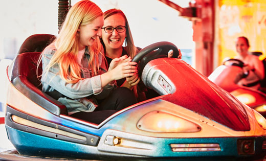 It was all smiles on the dodgems! July 2019