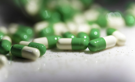 Green_and_white_drug_capsules