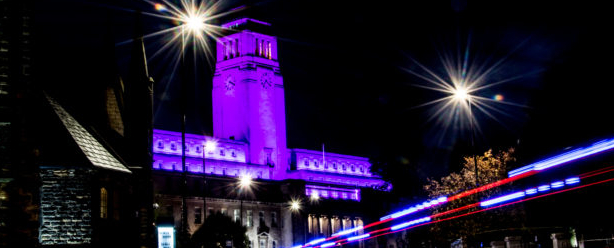 A file photo of the Parkinson Building lit up purple. Uploaded April 2021.