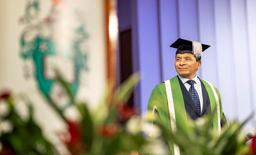 Interim Vice Chancellor Hai Sui in graduation gown